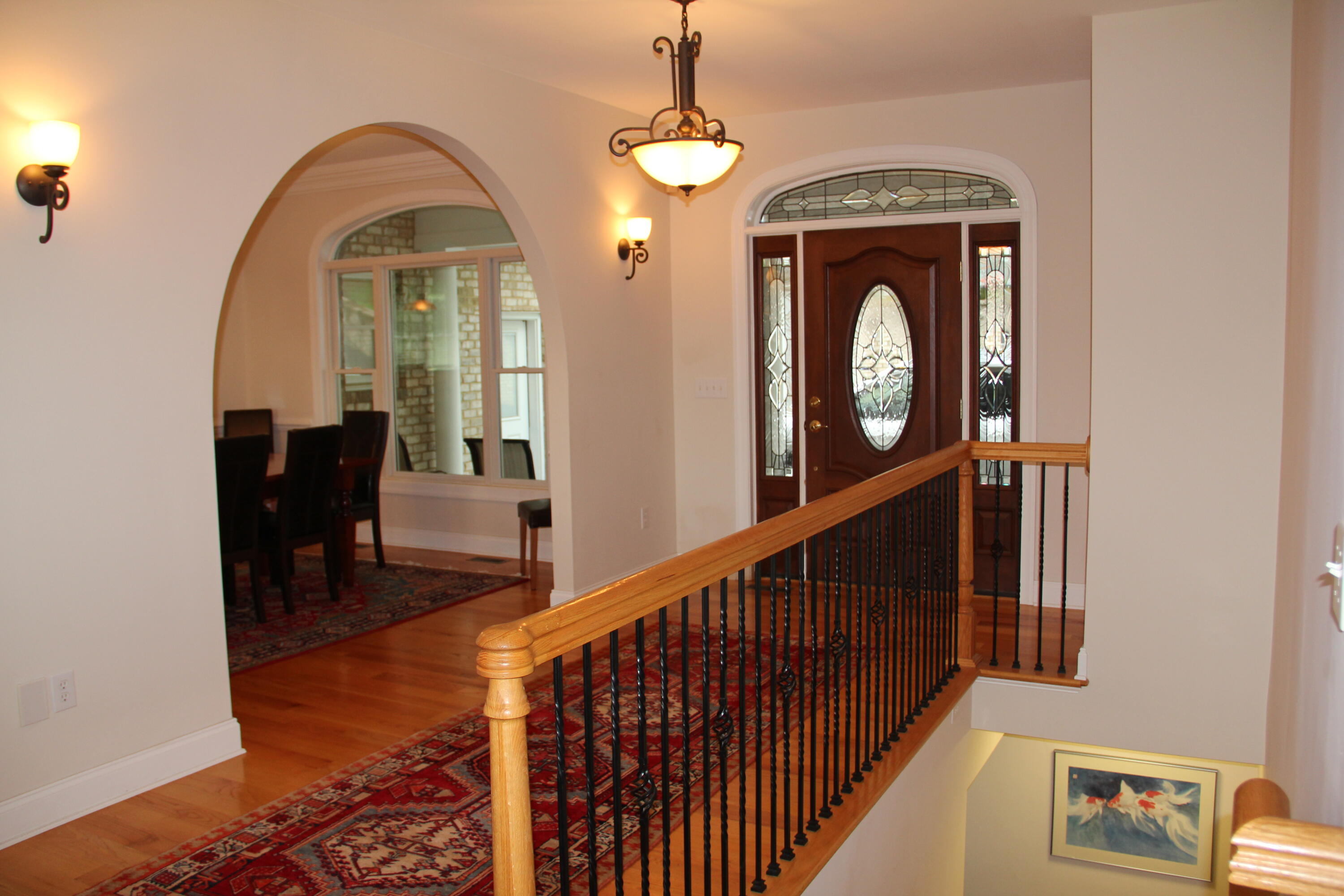 4 Calypso Road Moneta, VA 24121 - Photo 12 of 78 a view of a livingroom with furniture wooden floor windows and a chandelier
