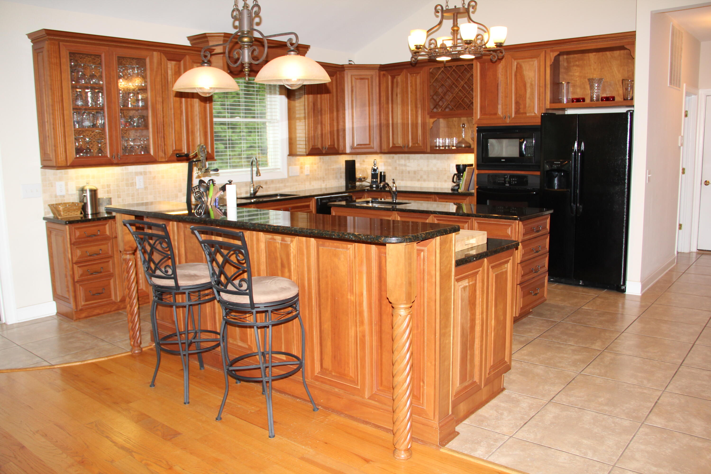 4 Calypso Road Moneta, VA 24121 - Photo 23 of 78 a kitchen with stainless steel appliances a dining table chairs and a refrigerator