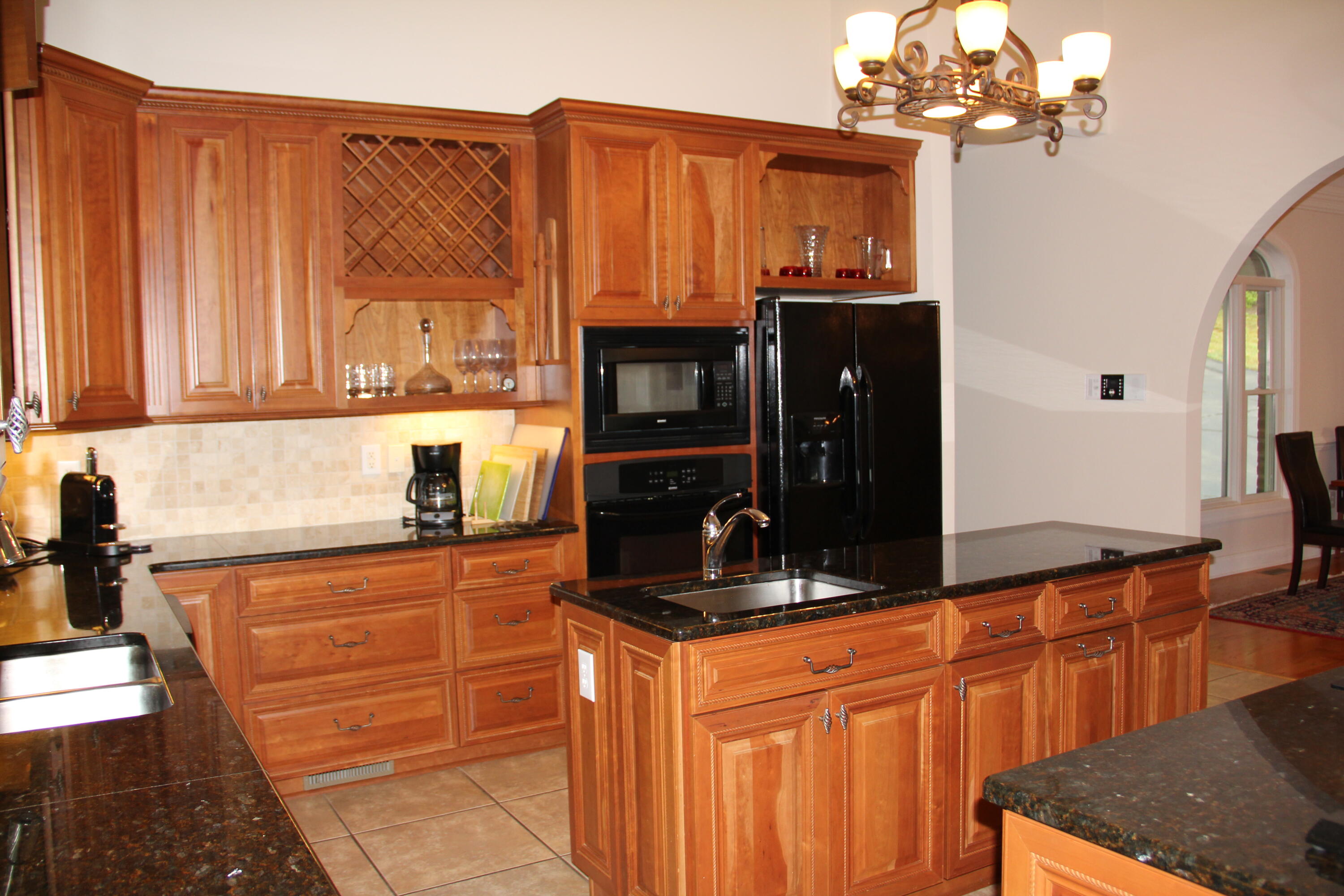 4 Calypso Road Moneta, VA 24121 - Photo 27 of 78 a kitchen with stainless steel appliances granite countertop a refrigerator oven a sink dishwasher and granite countertops with wooden floor