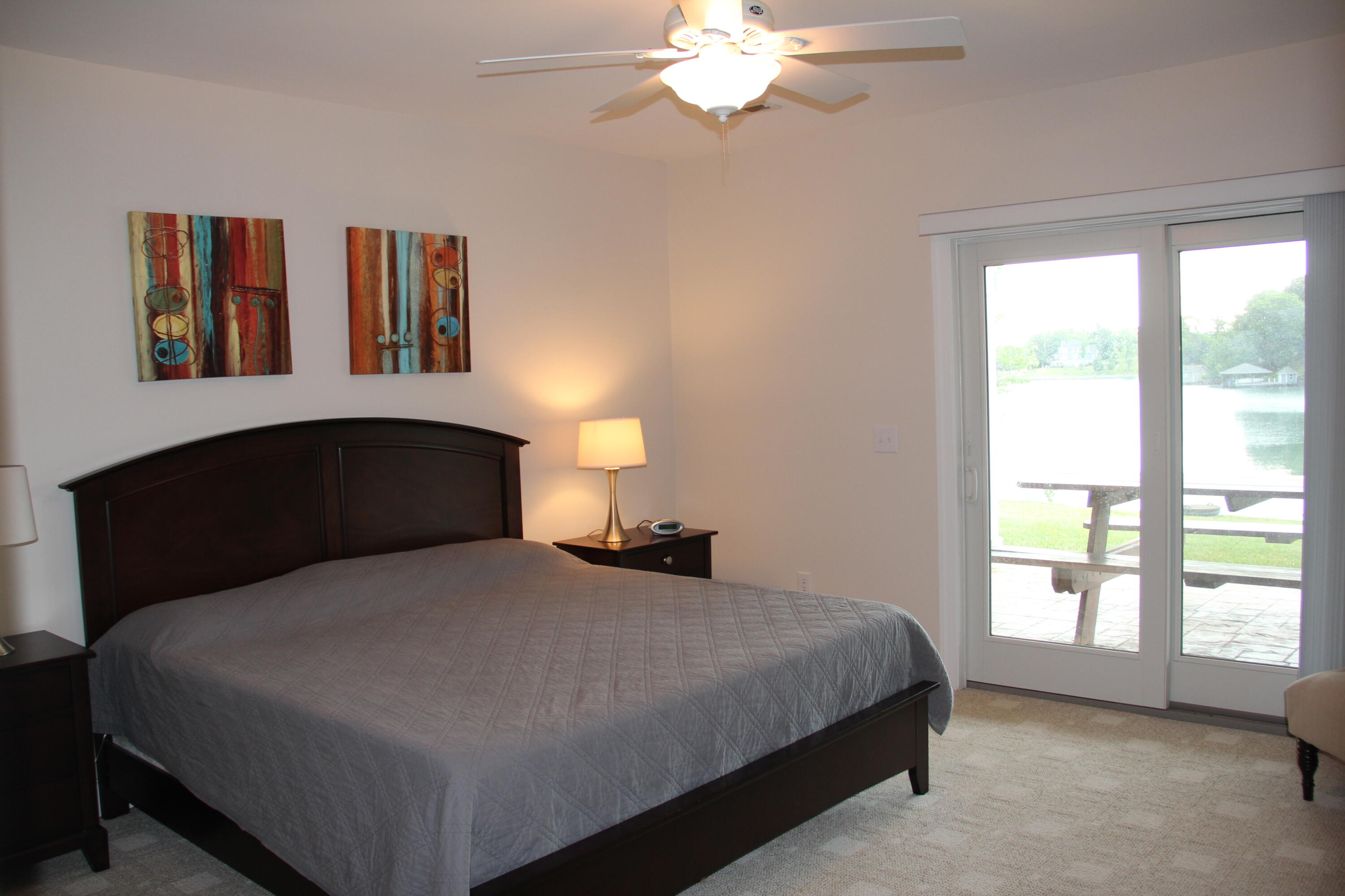 4 Calypso Road Moneta, VA 24121 - Photo 53 of 78 a bedroom with a bed and a chandelier