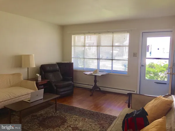 a living room with furniture window and a window