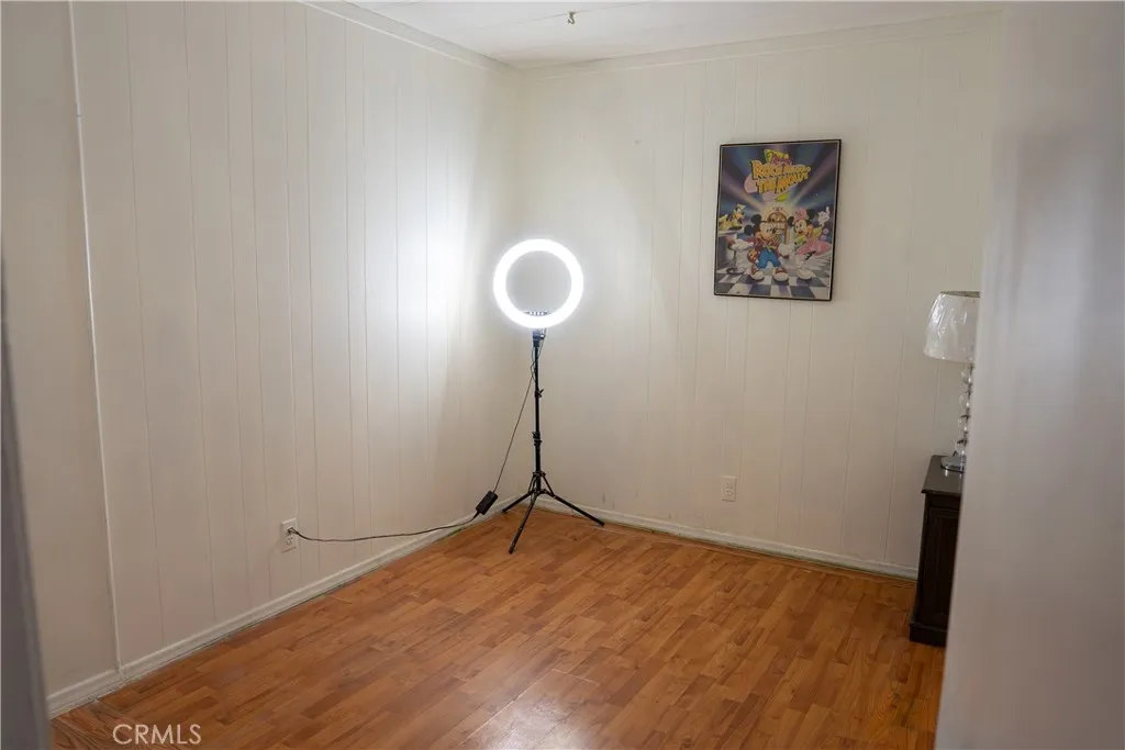 250 North Linden Avenue, Unit 248 Rialto, CA 92376 - Photo 12 of 13 a view of a room with wooden floor