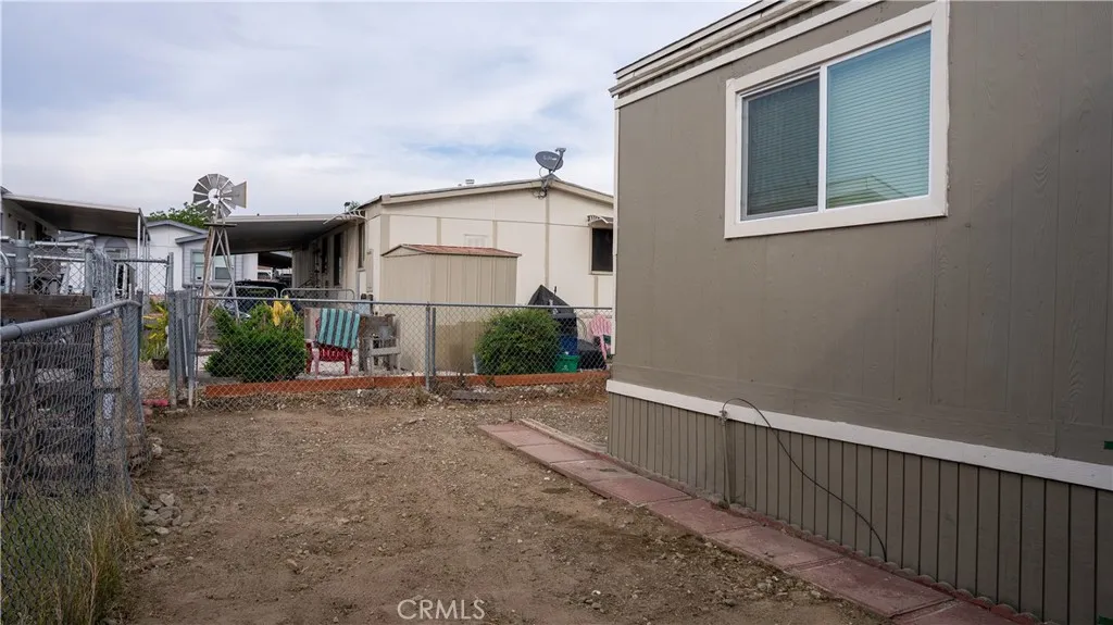 250 North Linden Avenue, Unit 248 Rialto, CA 92376 - Photo 10 of 13 a view of a street with a garage