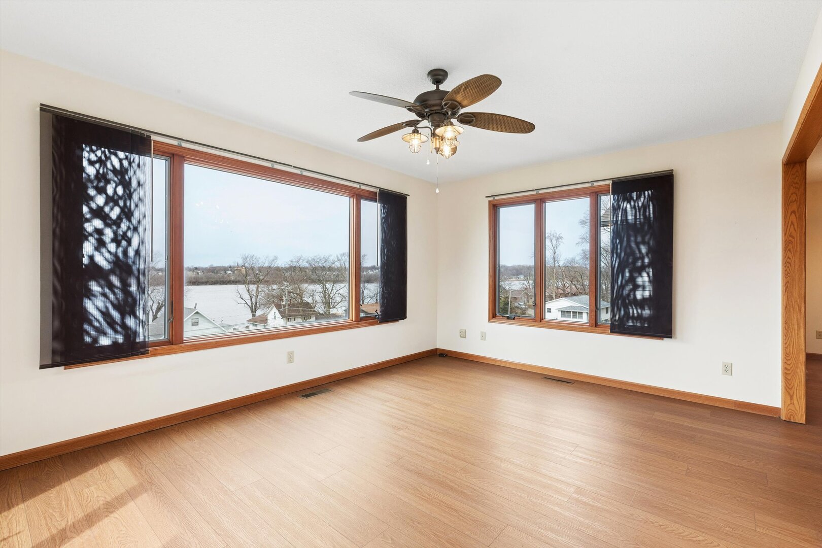 118 5th Street, Unit 2 Fulton, IL 61252 - Photo 11 of 54 a view of an empty room with wooden floor and a window
