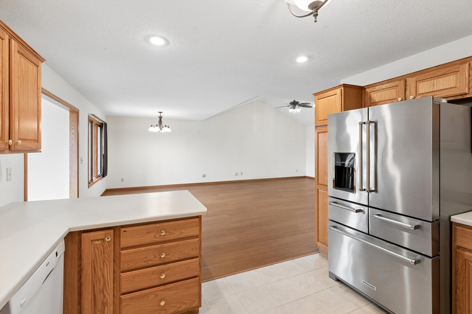 118 5th Street, Unit 2 Fulton, IL 61252 - Photo 14 of 54 a kitchen with stainless steel appliances granite countertop a refrigerator and a stove