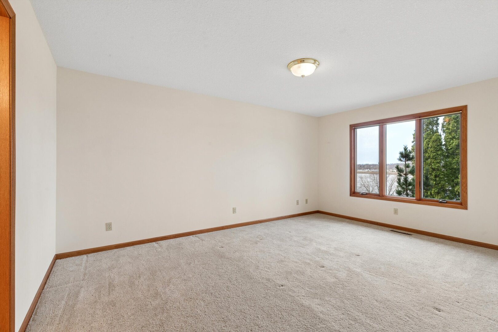 118 5th Street, Unit 2 Fulton, IL 61252 - Photo 15 of 54 an empty room with windows and view