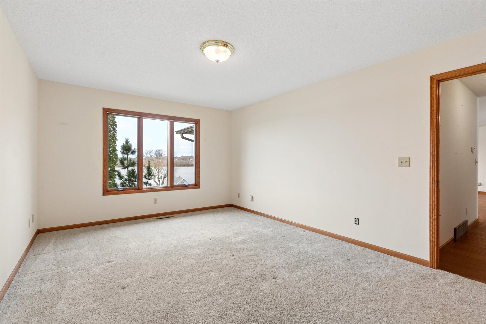 118 5th Street, Unit 2 Fulton, IL 61252 - Photo 16 of 54 an empty room with windows and closet