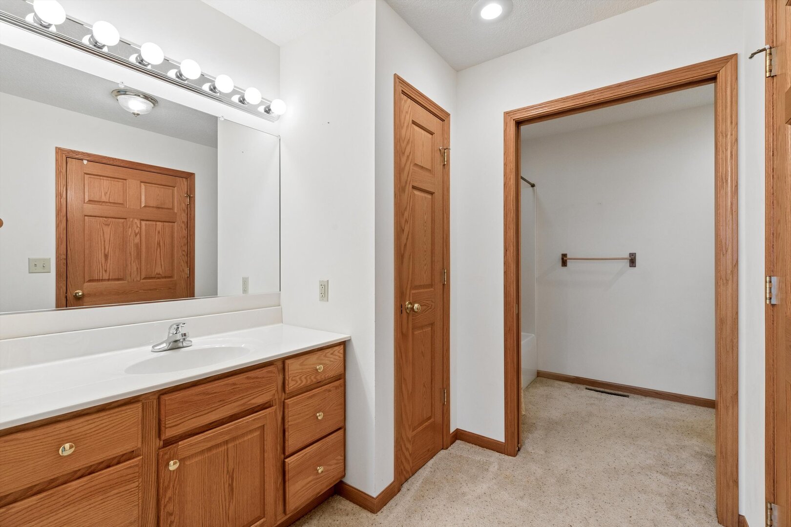 118 5th Street, Unit 2 Fulton, IL 61252 - Photo 18 of 54 a bathroom with a sink double vanity and a mirror