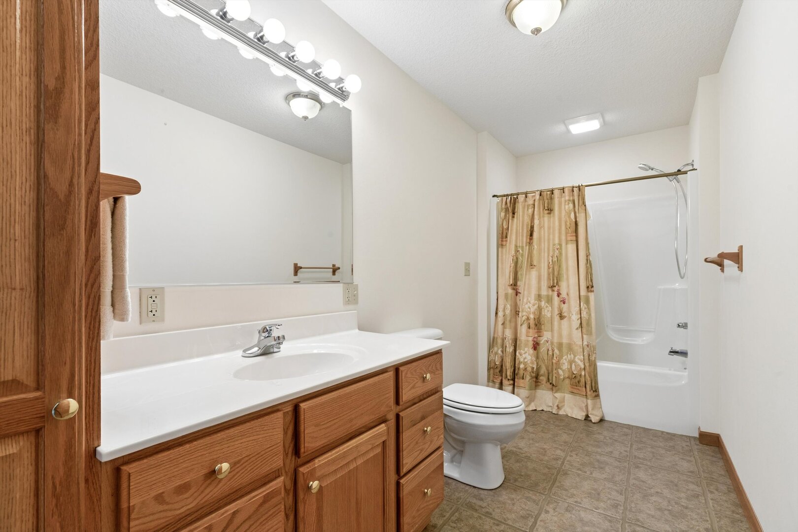 118 5th Street, Unit 2 Fulton, IL 61252 - Photo 23 of 54 a bathroom with a sink toilet and shower