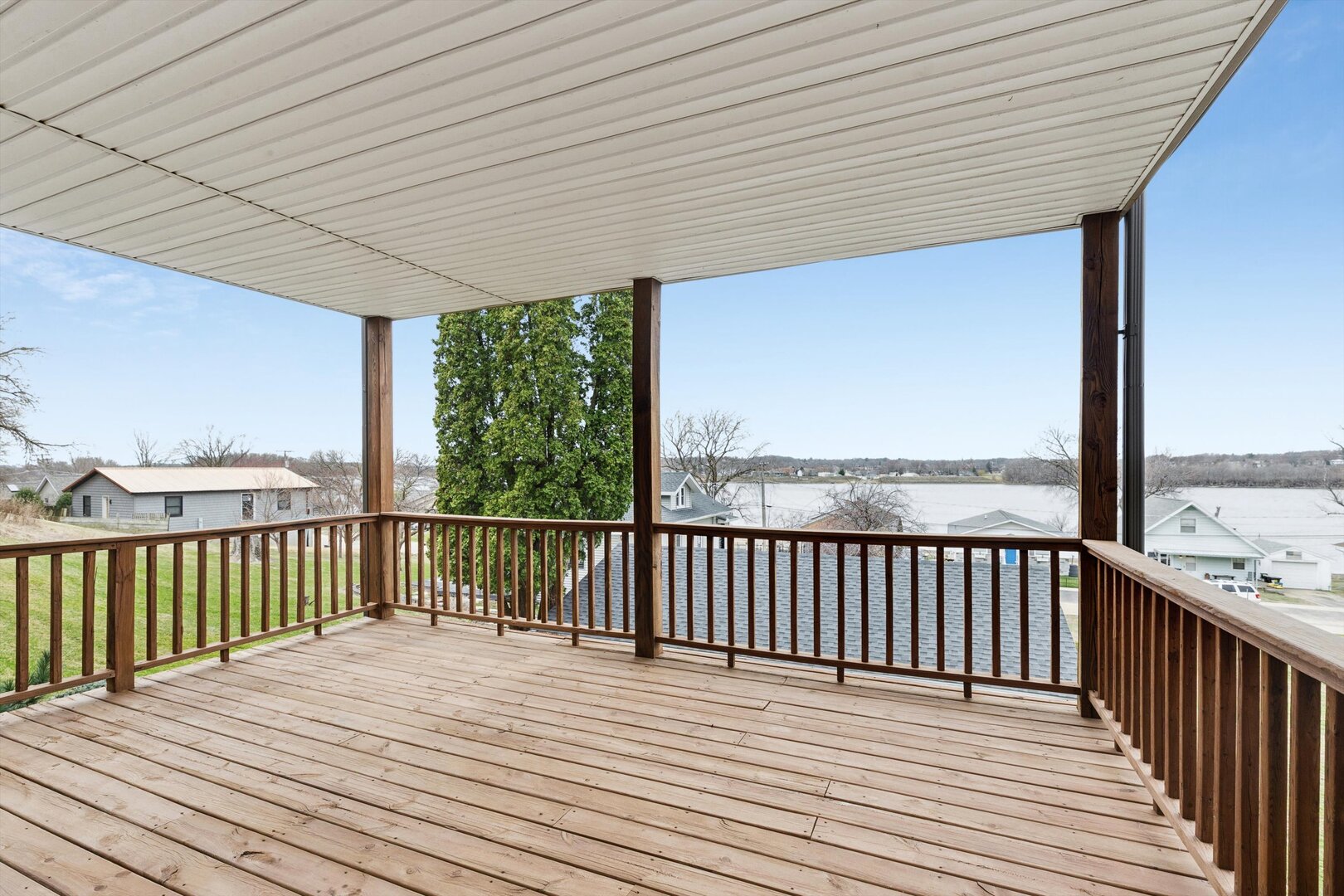 118 5th Street, Unit 2 Fulton, IL 61252 - Photo 27 of 54 a view of balcony with wooden floor & fence