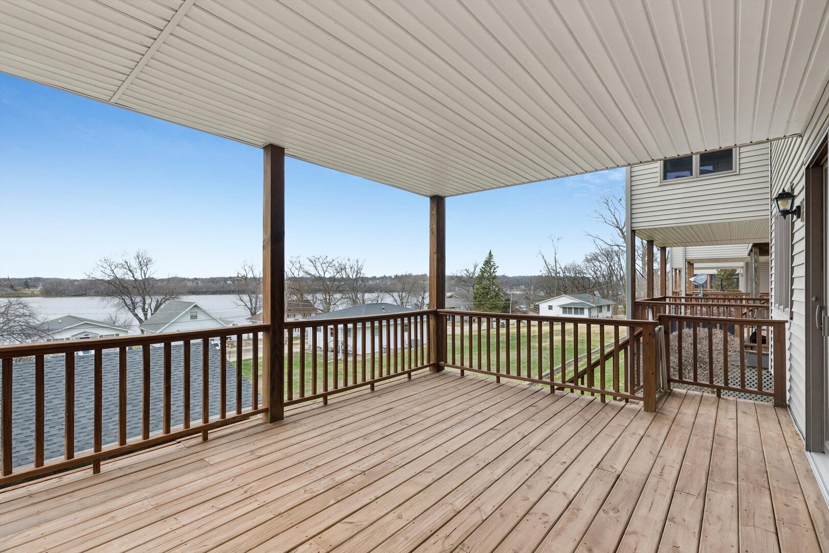 118 5th Street, Unit 2 Fulton, IL 61252 - Photo 29 of 54 a view of a balcony with wooden floor