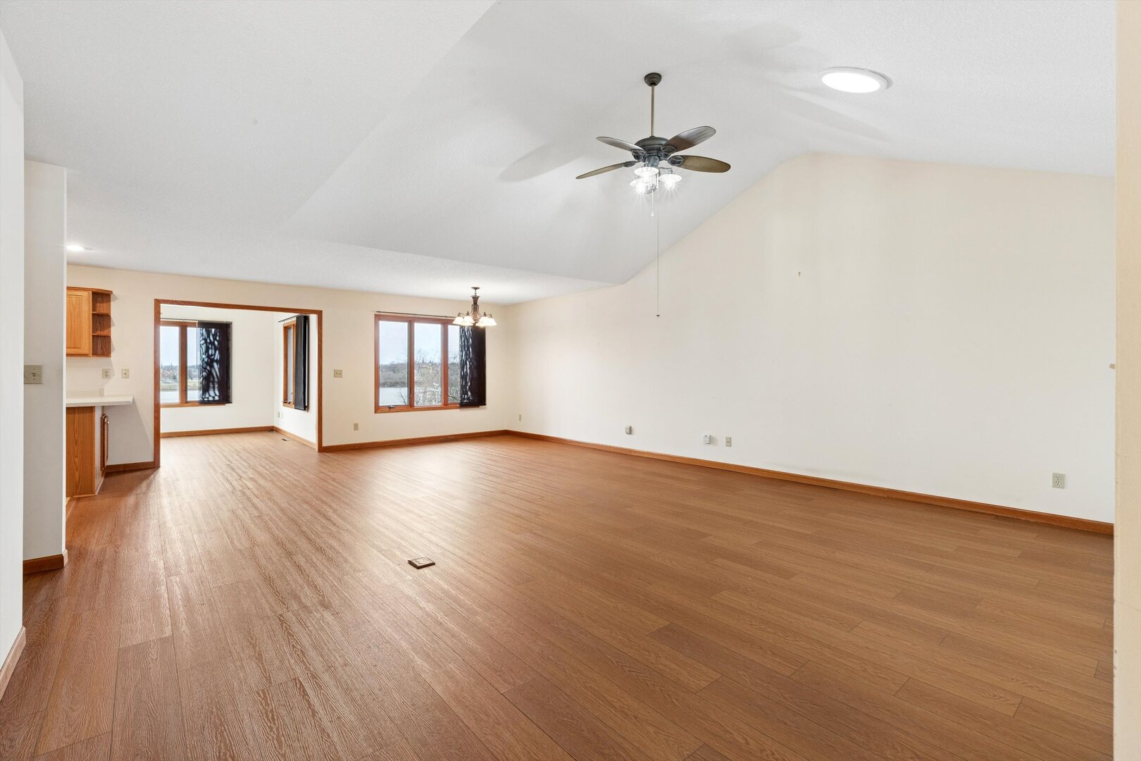 118 5th Street, Unit 2 Fulton, IL 61252 - Photo 3 of 54 a view of an empty room with wooden floor and a window