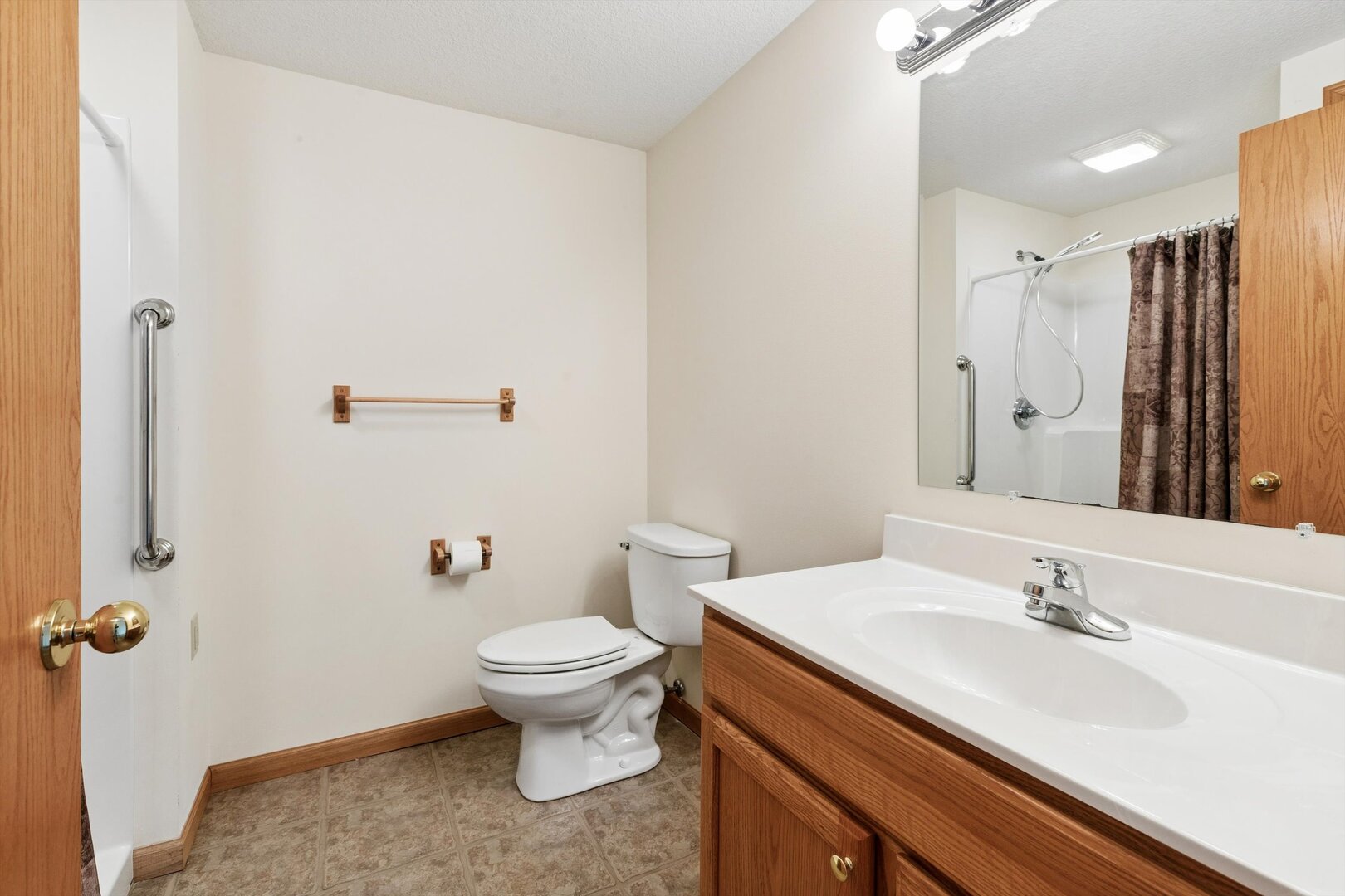 118 5th Street, Unit 2 Fulton, IL 61252 - Photo 32 of 54 a bathroom with a sink toilet and shower