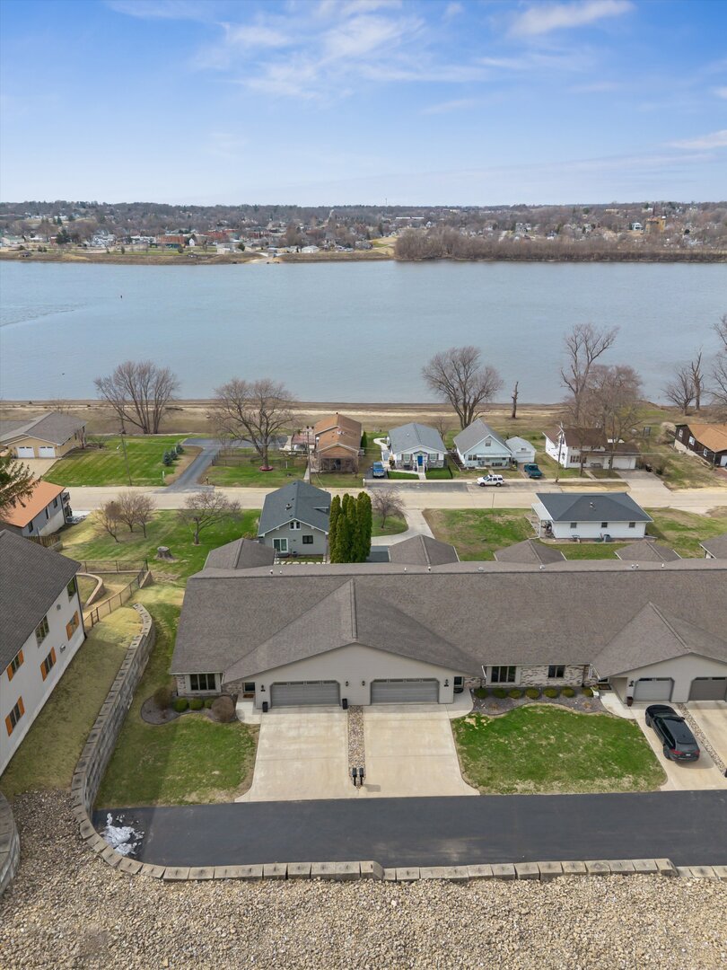118 5th Street, Unit 2 Fulton, IL 61252 - Photo 40 of 54 a view of a lake with a yard and outdoor space