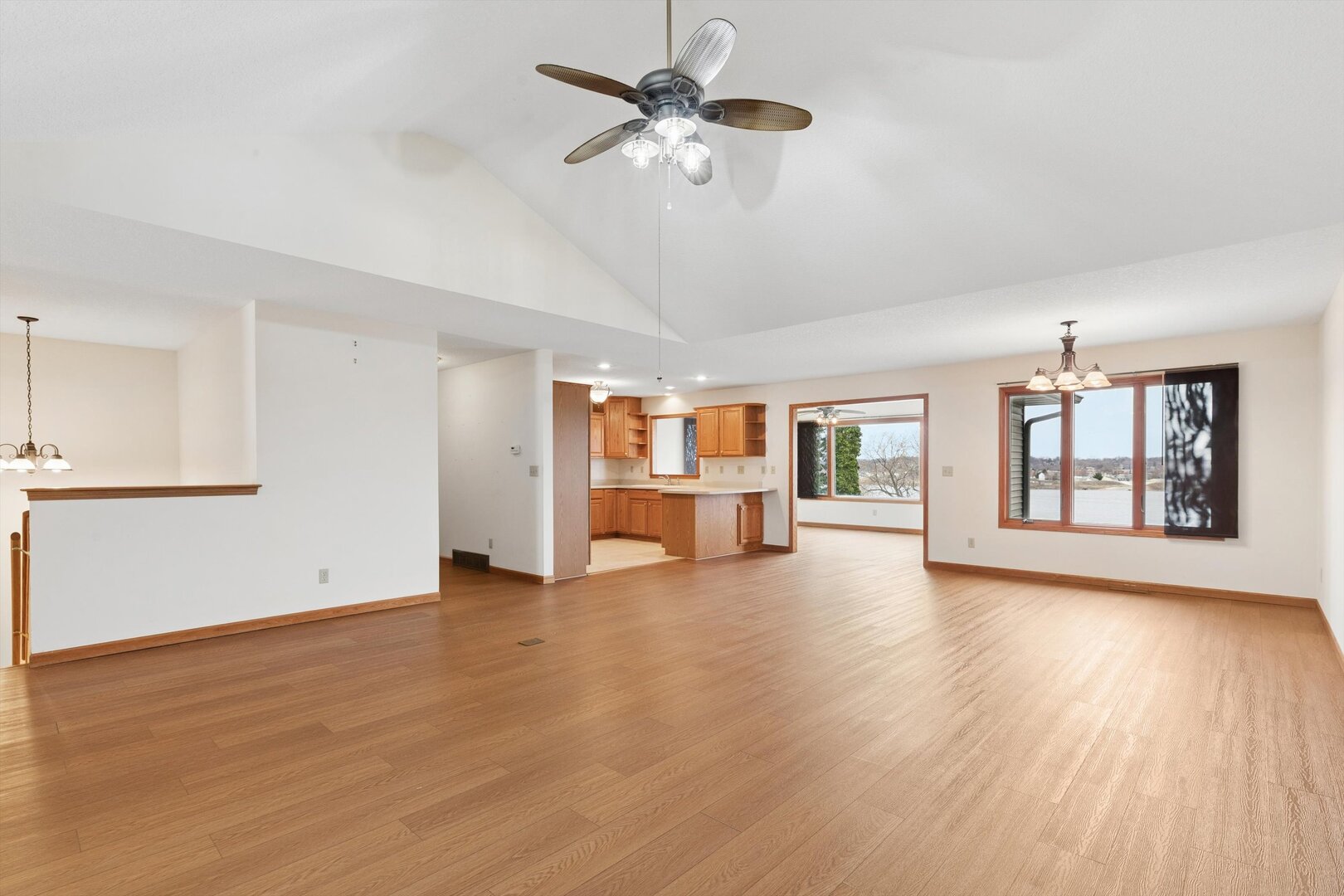 118 5th Street, Unit 2 Fulton, IL 61252 - Photo 4 of 54 a view of an empty room with window and wooden floor