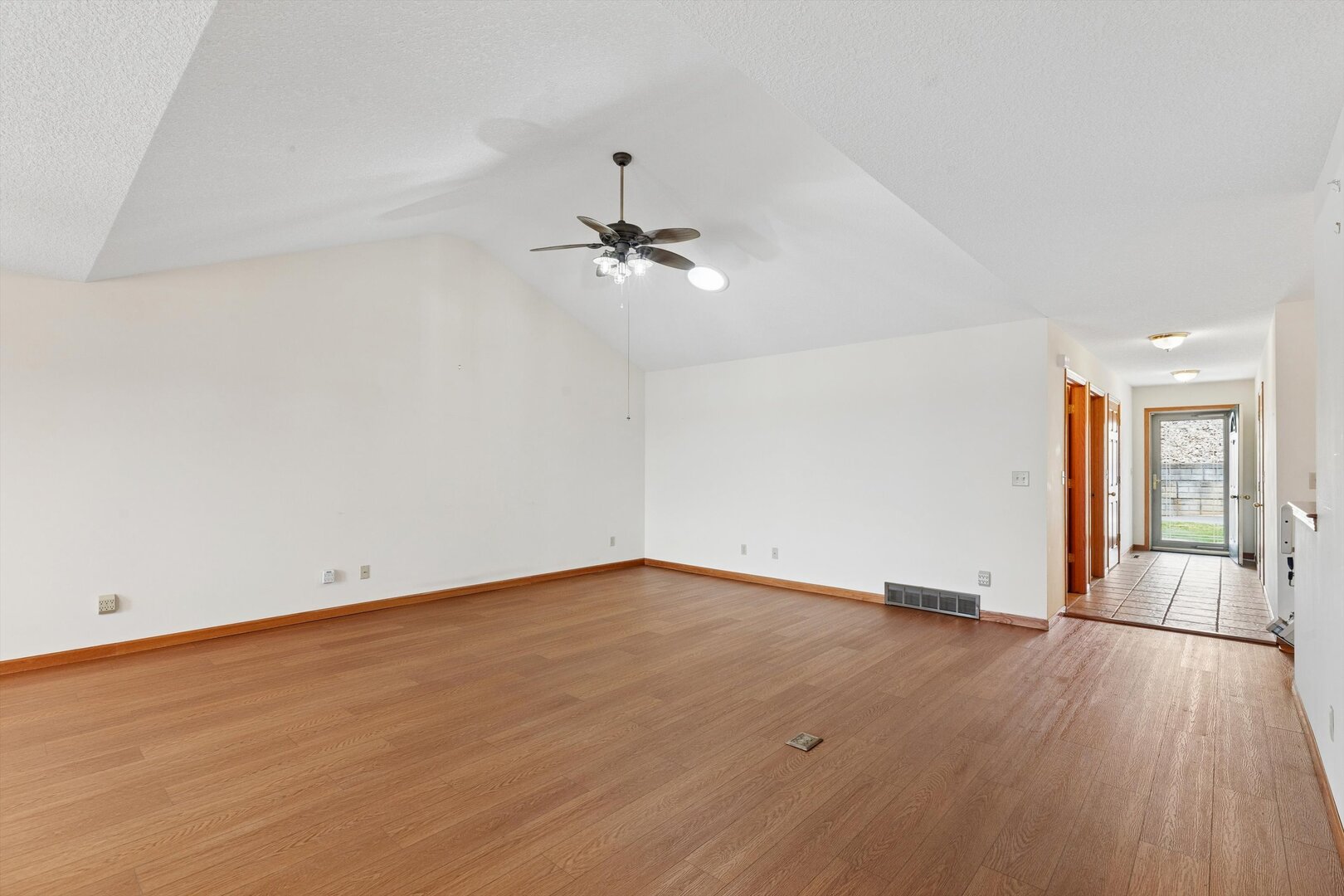 118 5th Street, Unit 2 Fulton, IL 61252 - Photo 6 of 54 wooden floor in an empty room with a window