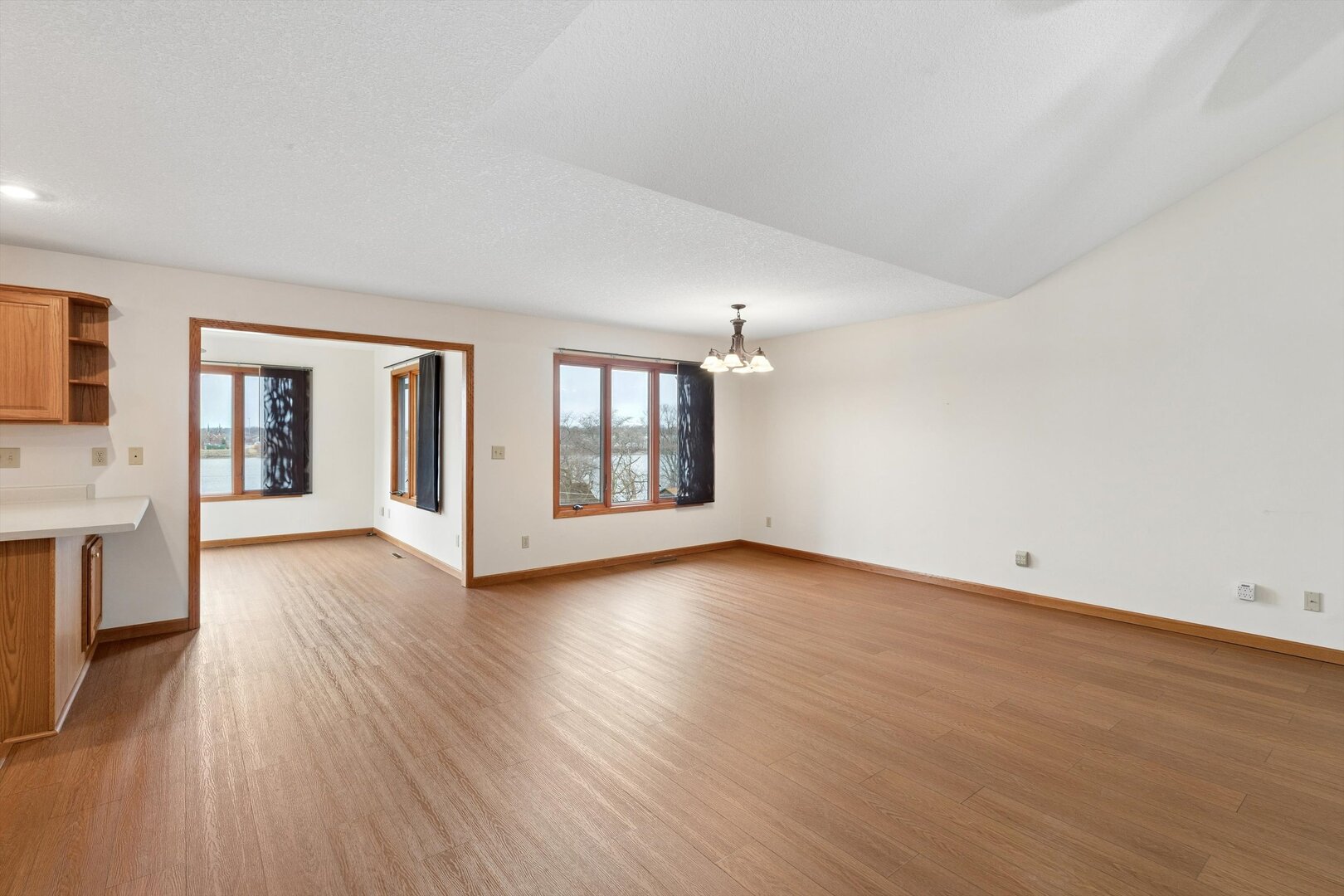 118 5th Street, Unit 2 Fulton, IL 61252 - Photo 7 of 54 a view of an empty room with wooden floor and a window