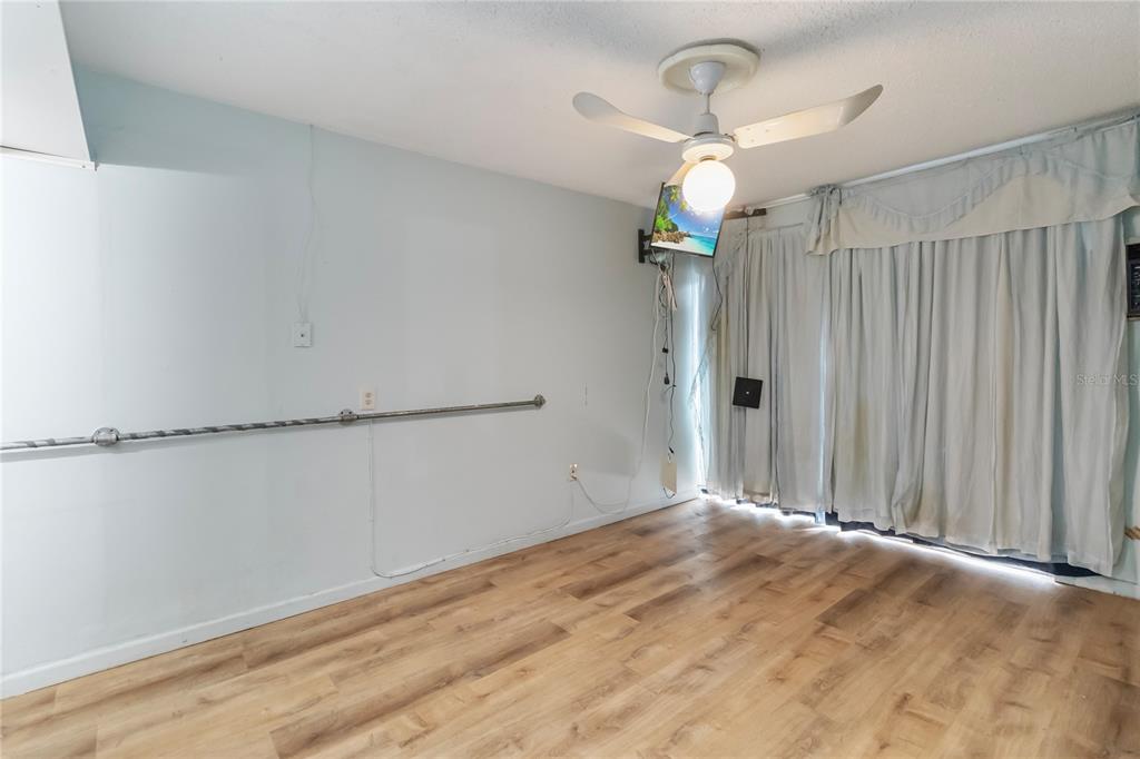 1730 Neptune Road Kissimmee, FL 34744 - Photo 16 of 38 a view of a room with wooden floor