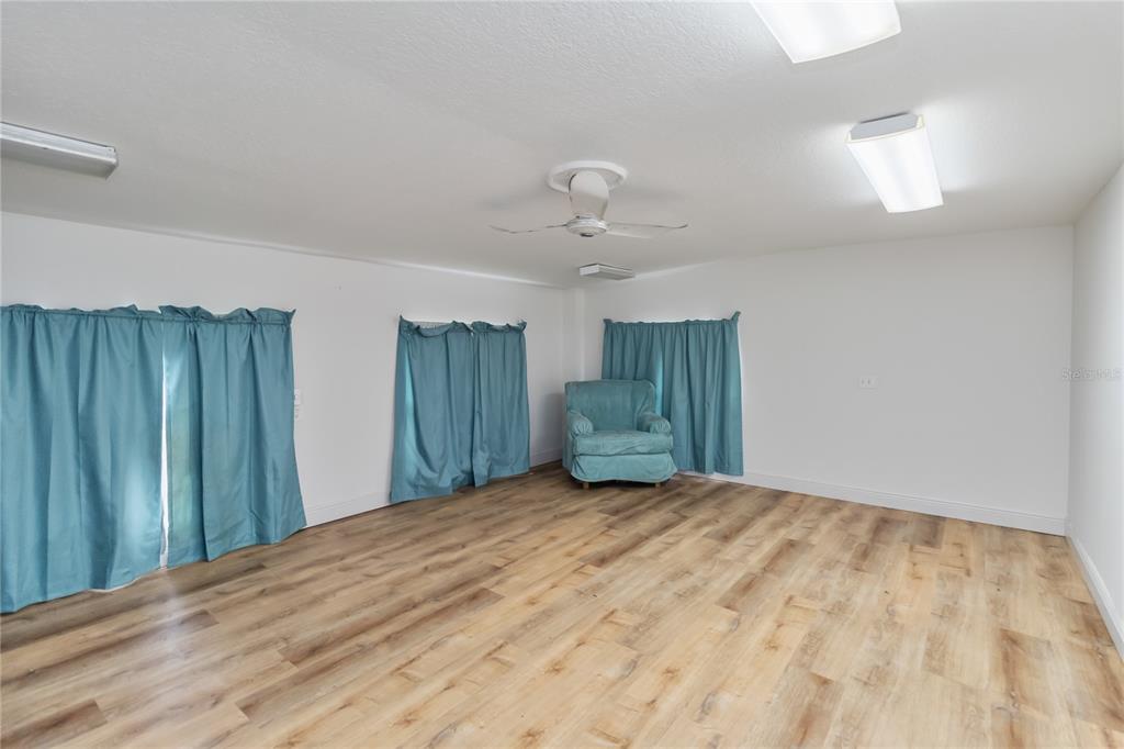 1730 Neptune Road Kissimmee, FL 34744 - Photo 20 of 38 a bedroom with a bed and a view