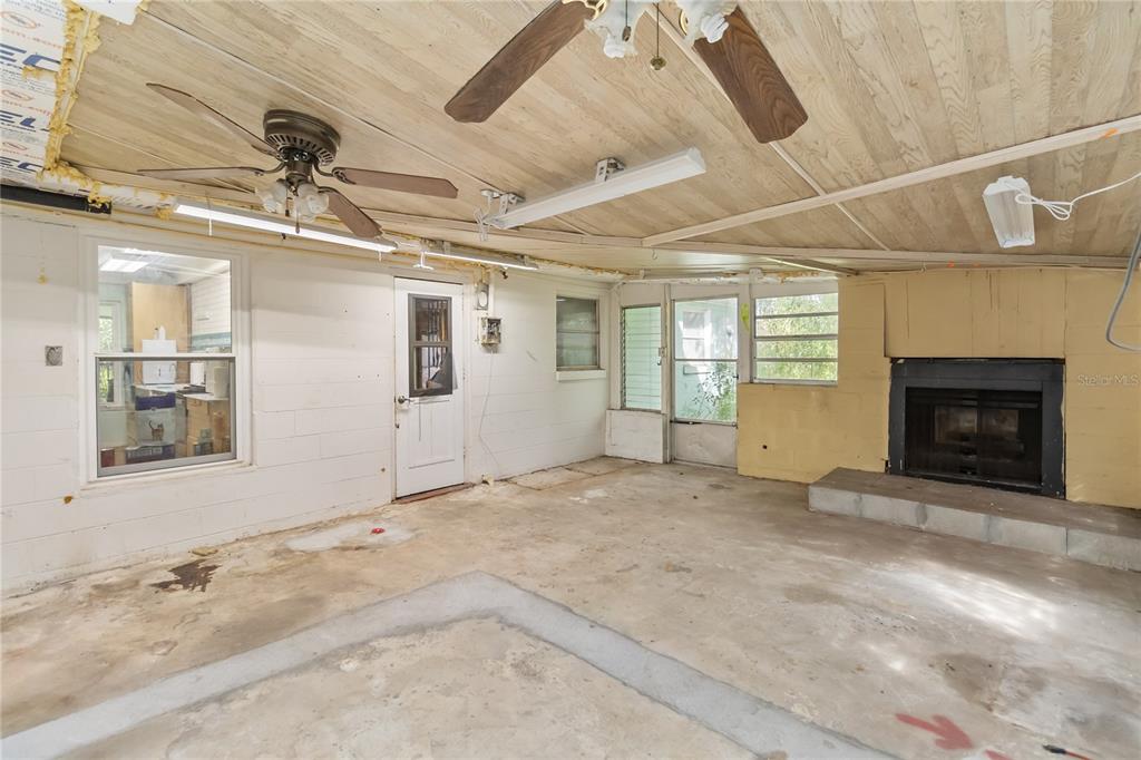 1730 Neptune Road Kissimmee, FL 34744 - Photo 22 of 38 a view of an empty room with a fireplace