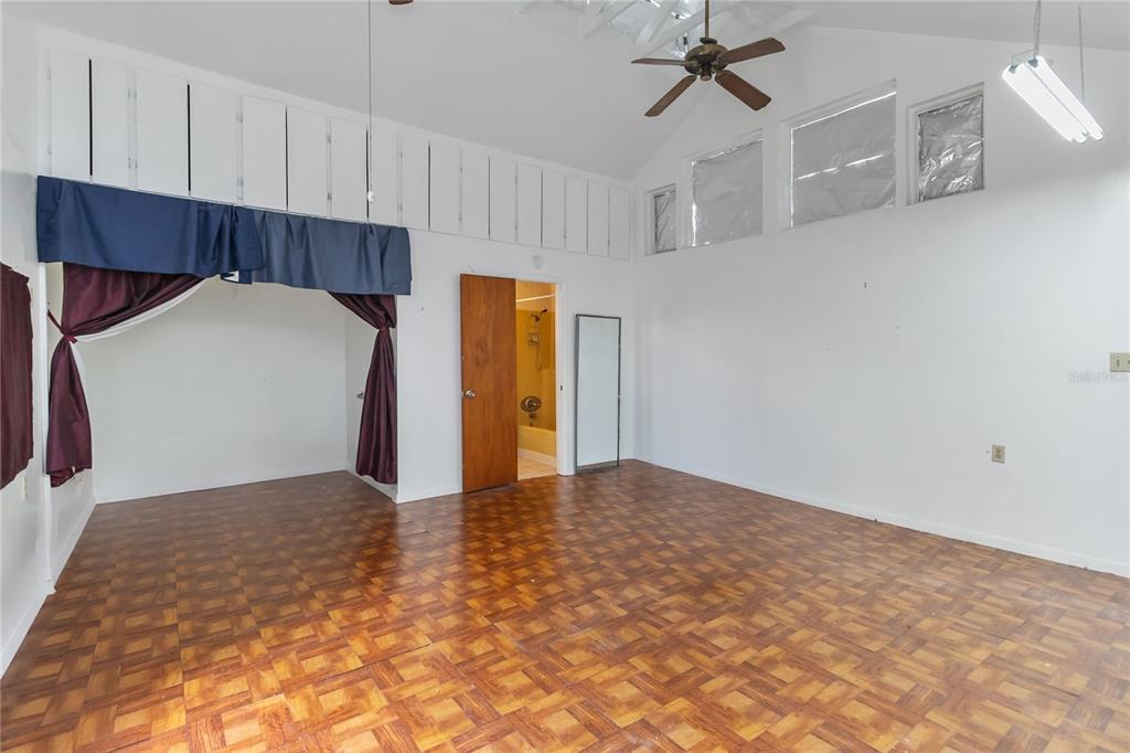 1730 Neptune Road Kissimmee, FL 34744 - Photo 27 of 38 a view of a kitchen with a sink and cabinets