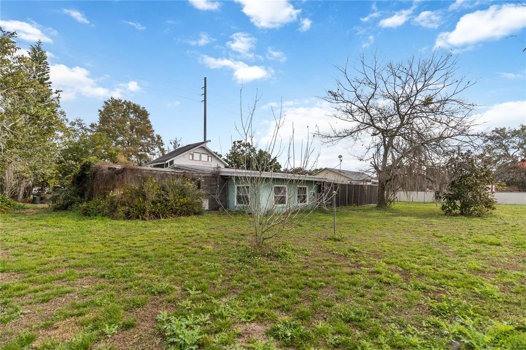 1730 Neptune Road Kissimmee, FL 34744 - Photo 32 of 38 a front view of house with yard and trees