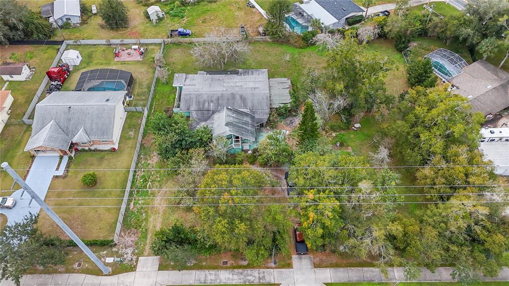 1730 Neptune Road Kissimmee, FL 34744 - Photo 33 of 38 an aerial view of houses with yard