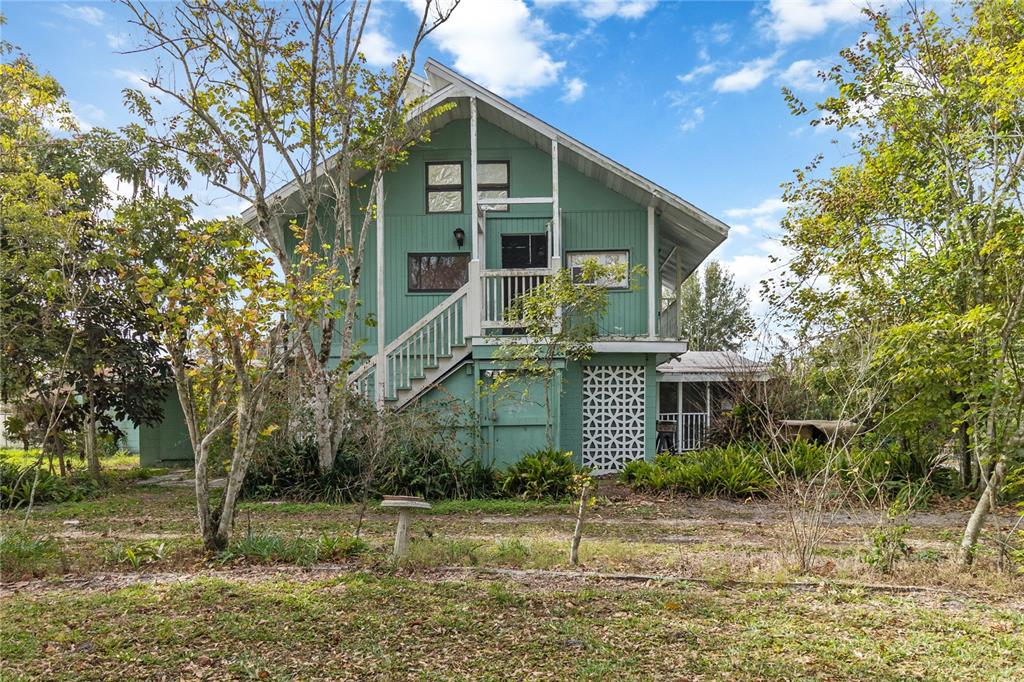1730 Neptune Road Kissimmee, FL 34744 - Photo 5 of 38 front view of house with a yard