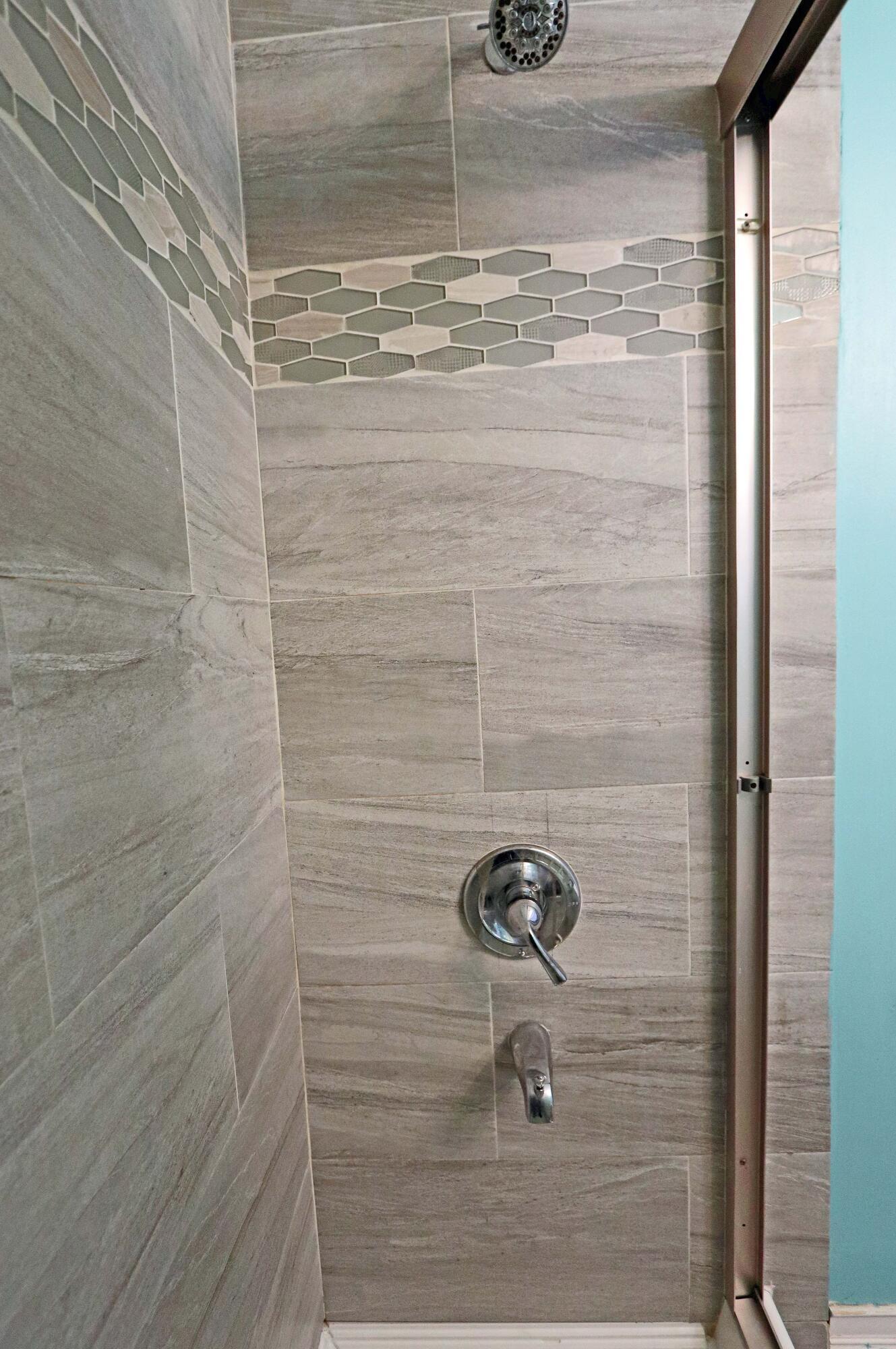 4569 Stonehedge Road Columbus, OH 43231 - Photo 22 of 38 Shower with tile to ceiling