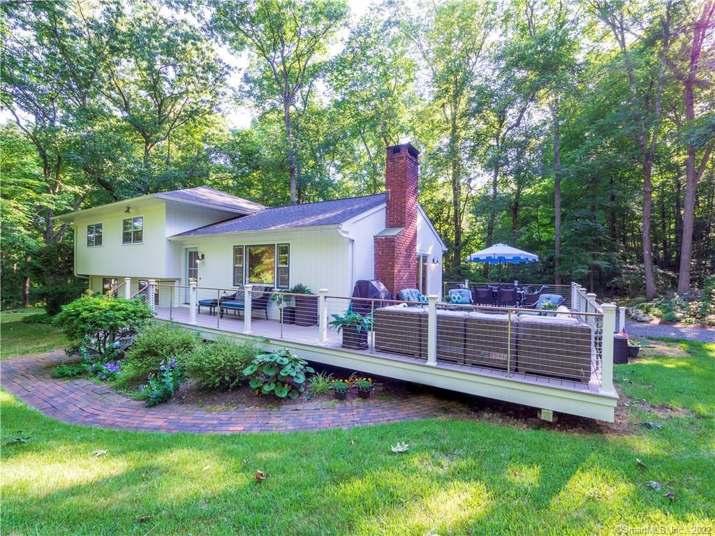 14 Hillside Road Weston, CT 06883 - Photo 1 of 1 a view of an house with backyard space and garden