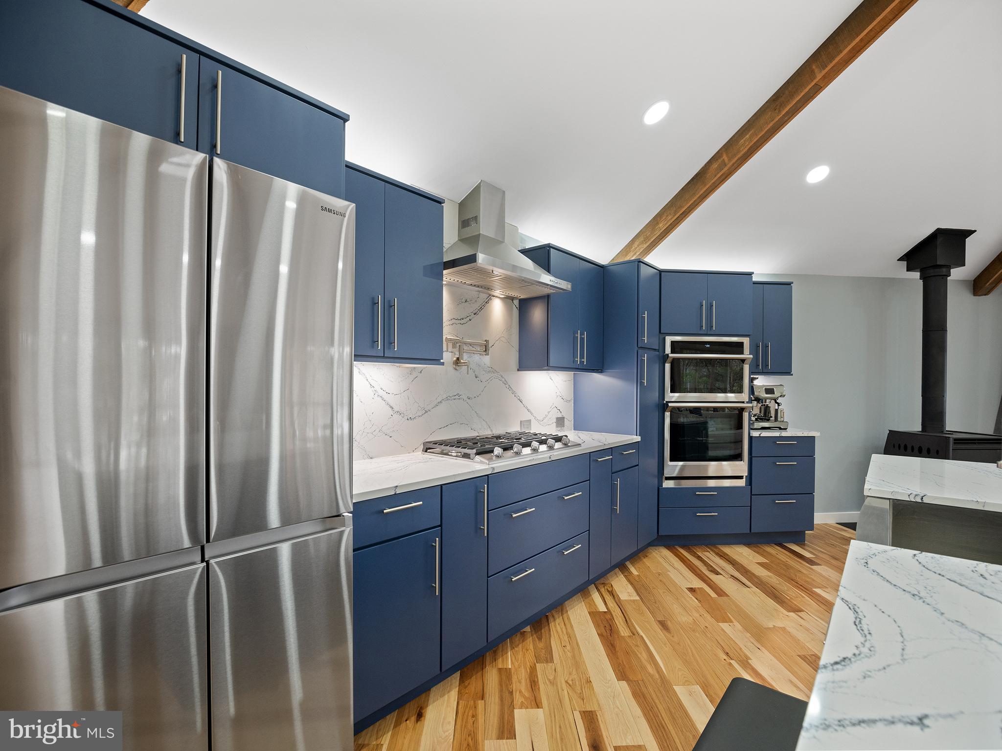 855 Big Road Lusby, MD 20657 - Photo 12 of 48 a kitchen with granite countertop a refrigerator stove and oven