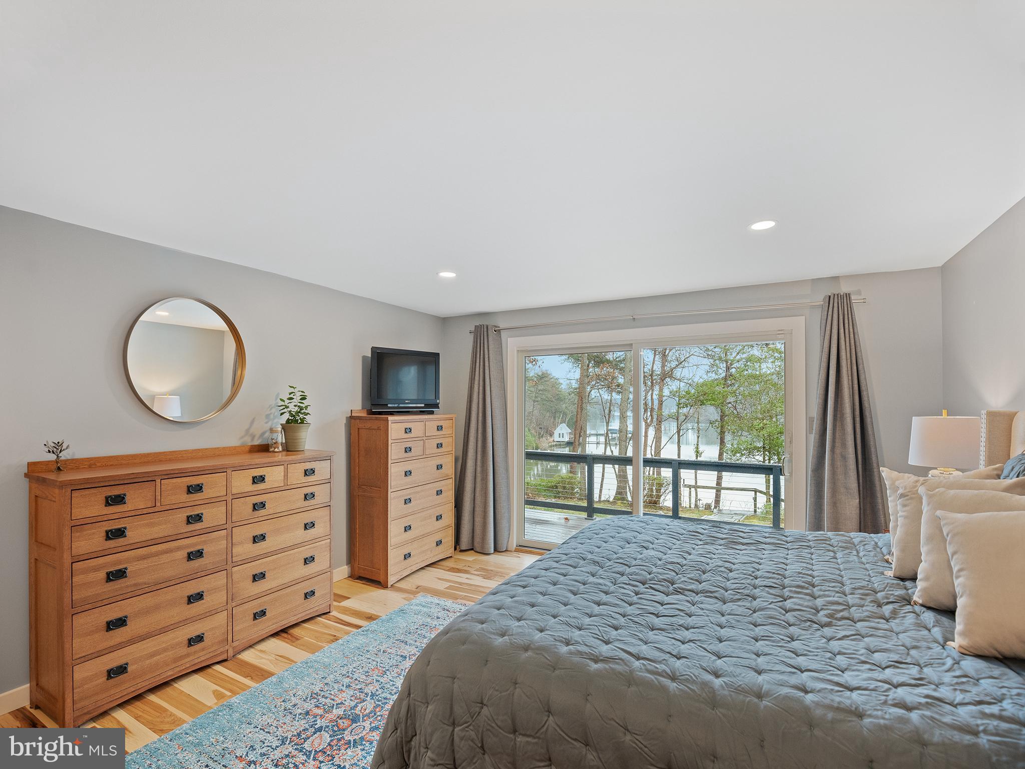 855 Big Road Lusby, MD 20657 - Photo 22 of 48 a bedroom with a bed closet and a large window