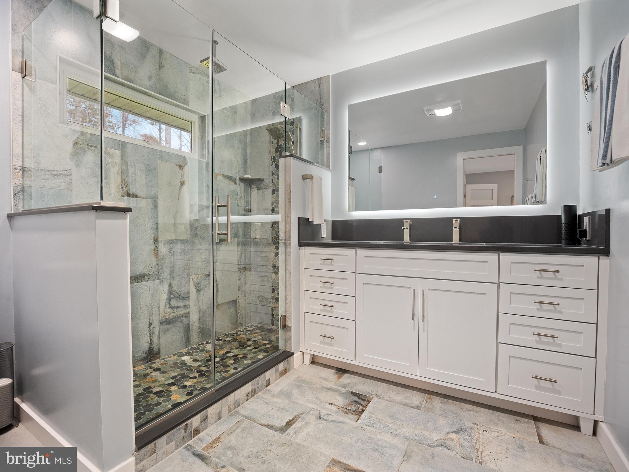 855 Big Road Lusby, MD 20657 - Photo 23 of 48 a spacious bathroom with a double vanity sink a shower and a mirror