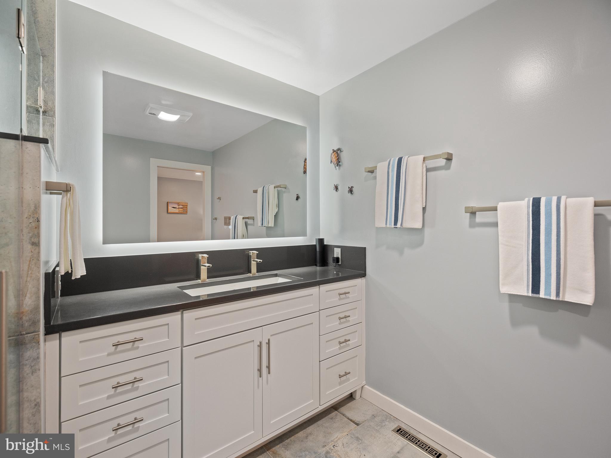855 Big Road Lusby, MD 20657 - Photo 25 of 48 a bathroom with a granite countertop sink and a mirror