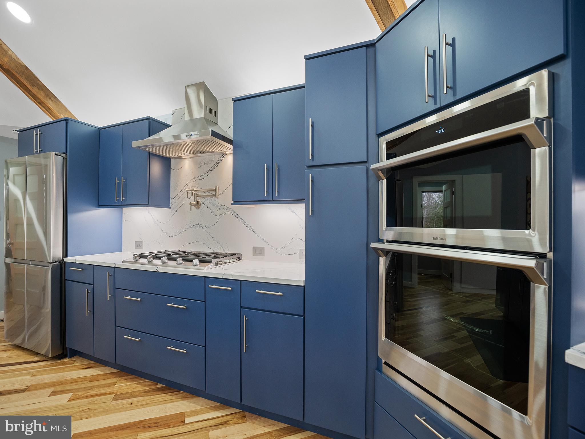 855 Big Road Lusby, MD 20657 - Photo 9 of 48 a kitchen with a stove microwave and refrigerator