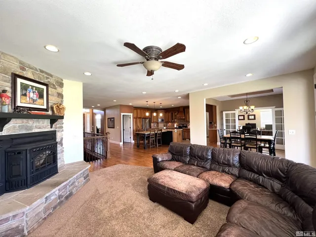 a work room with furniture bookshelf and a window