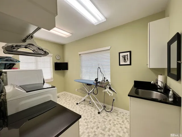 a bedroom with a bed couch and a window