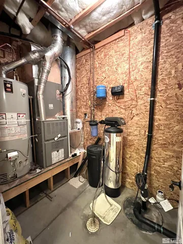 a view of a living room with furniture and a flat screen tv