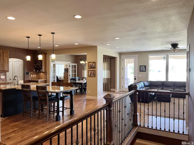 a kitchen with a sink cabinets and wooden floor