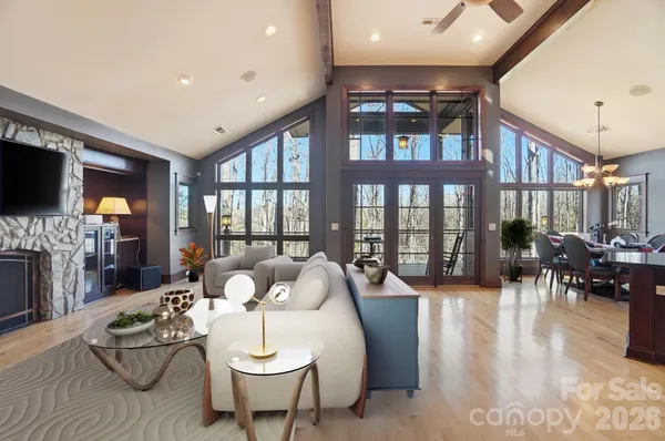 a living room with fireplace furniture and a flat screen tv