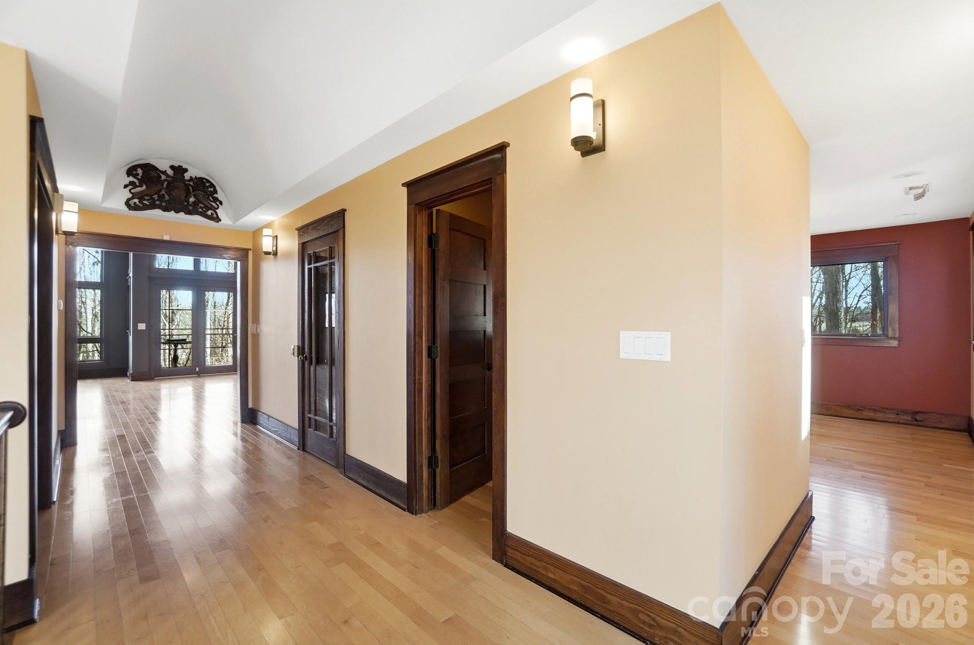 17928 Pages Pond Court Davidson, NC 28036 - Photo 17 of 48 a view of a hallway with wooden floor and entryway