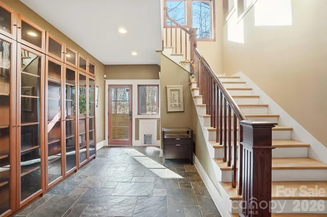 a view of entryway with stairs and furniture