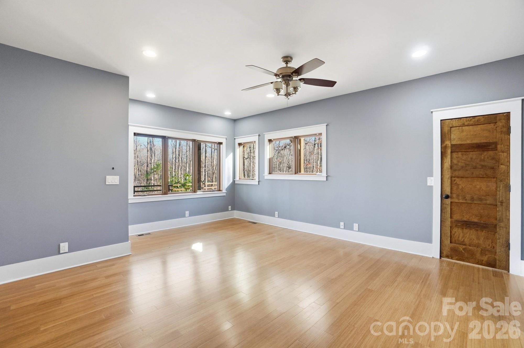 17928 Pages Pond Court Davidson, NC 28036 - Photo 31 of 48 a view of an empty room with wooden floor and a window