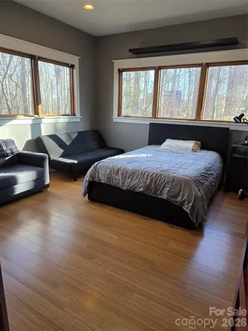 a spacious bedroom with a large bed and a couch