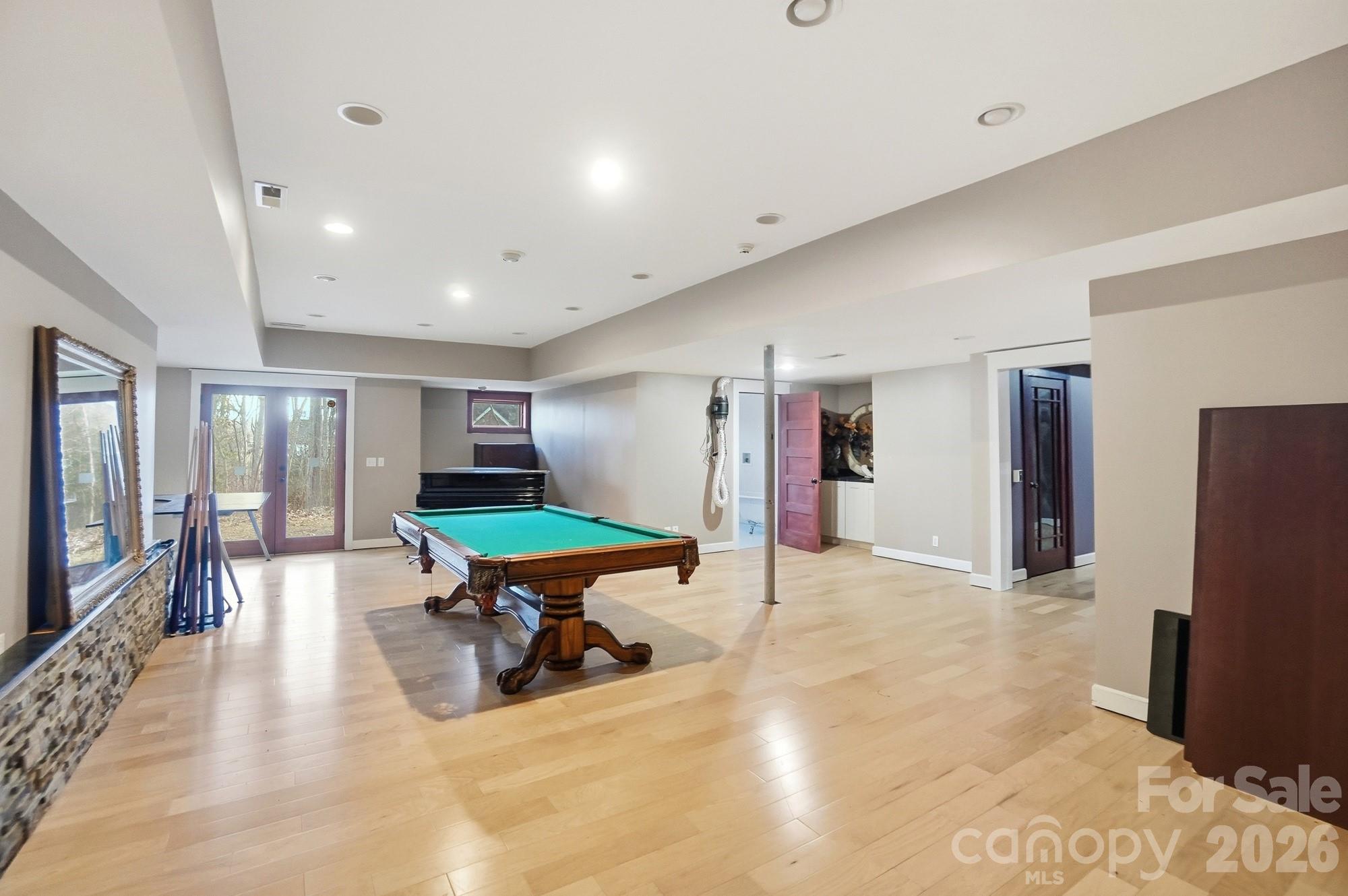 17928 Pages Pond Court Davidson, NC 28036 - Photo 37 of 48 a room with furniture and a flat screen tv