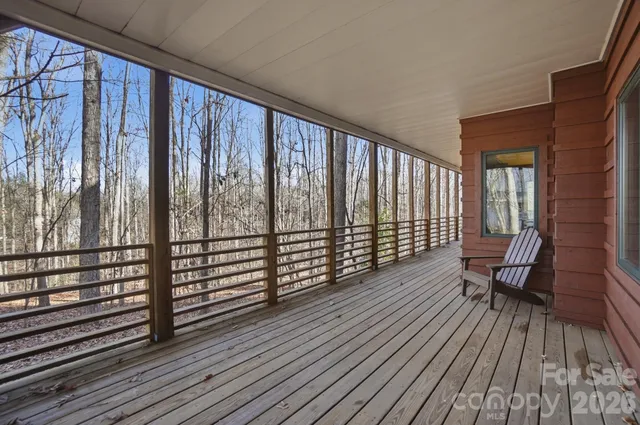 a view of a roof deck with wooden floor and outdoor space