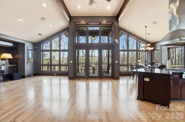 a view of front door with dining room and wooden floor
