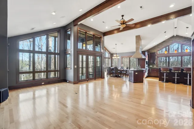 a view of an entryway with wooden floor