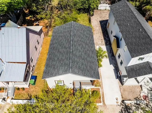 an aerial view of a house with swimming pool