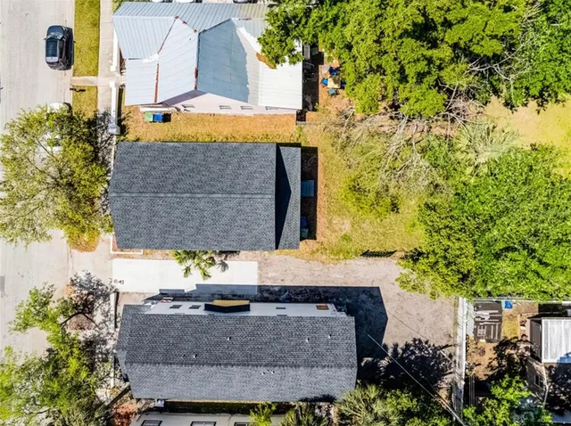 a view of house with a yard